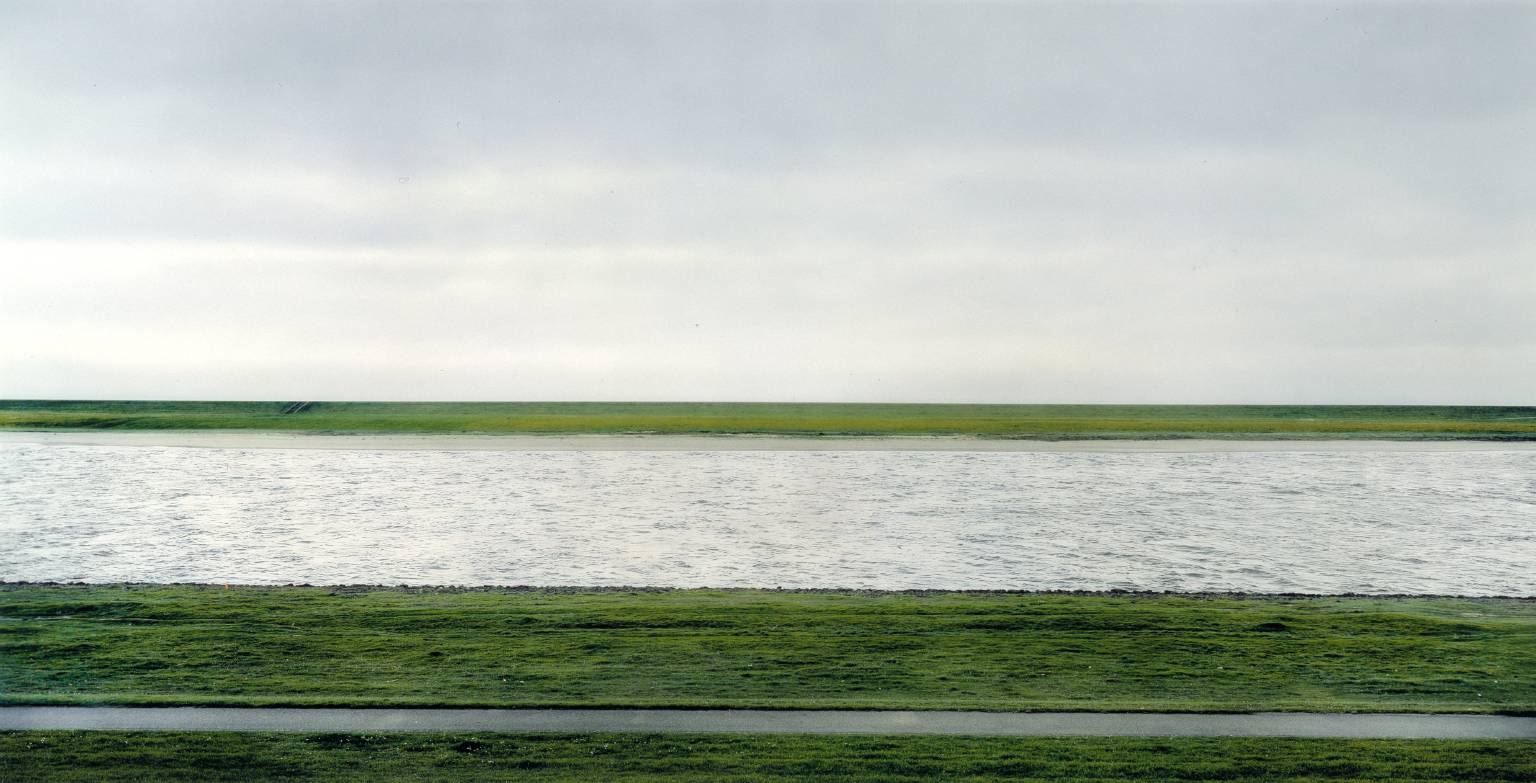 The most expensive photograph ever sold. Rhein II, made by German artist Andreas Gursky, 4.3 million.