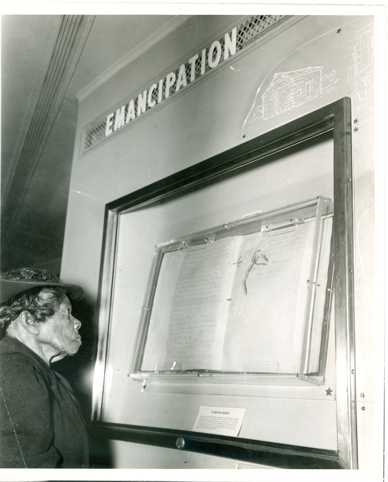 88-year-old Mrs. Sally Fickland, a former slave, looking at the Emancipation Proclamation in 1947, which was signed when she was 3