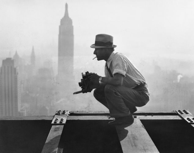 Charles Ebbets shooting his famous photograph, Lunch atop a Skyscraper, while perching on the 69th floor of the GE building. 1932