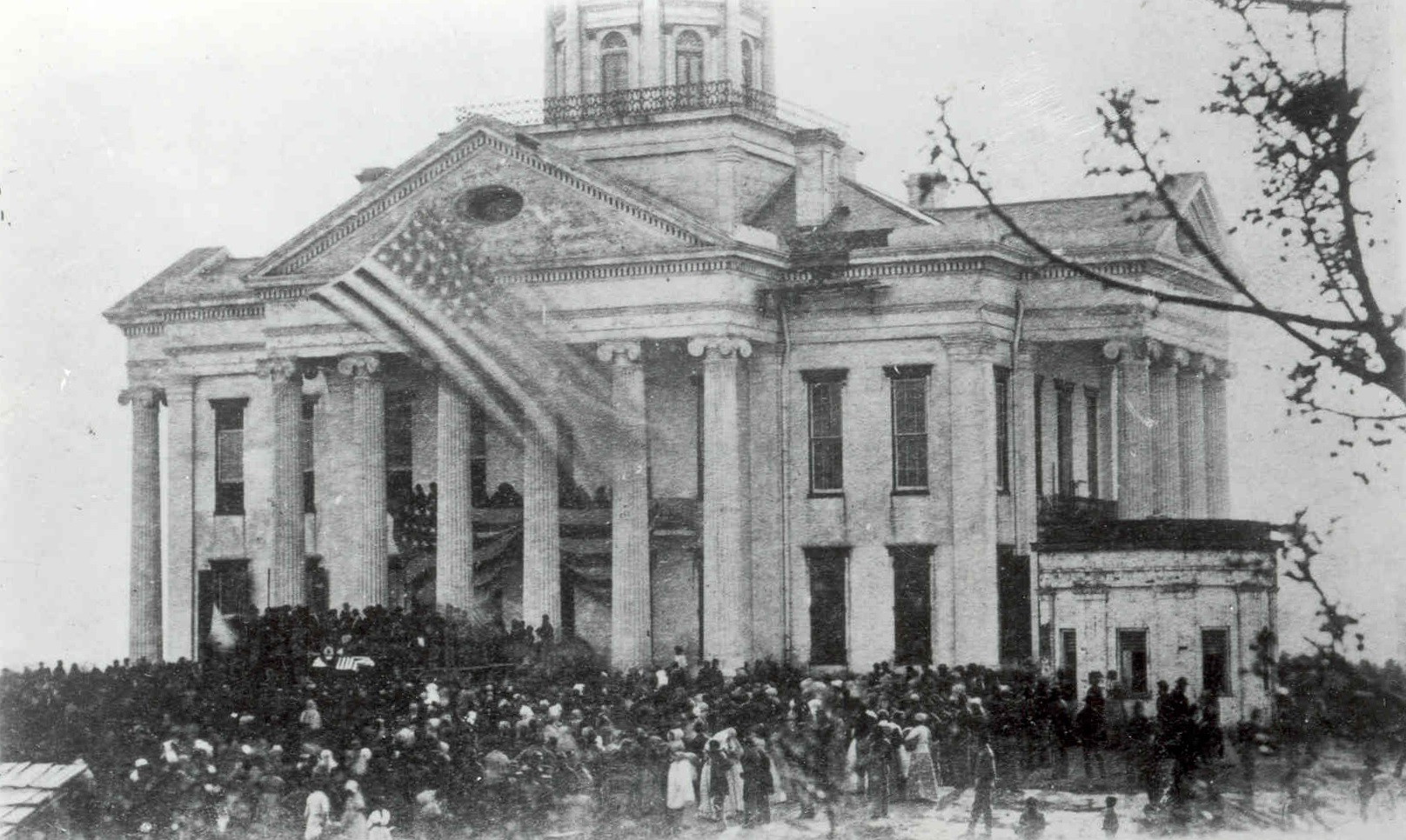 A large crowd of mostly African Americans mourning the death of President Abraham Lincoln in front of the Warren County Courthouse in Vicksburg, Mississippi, April 1865