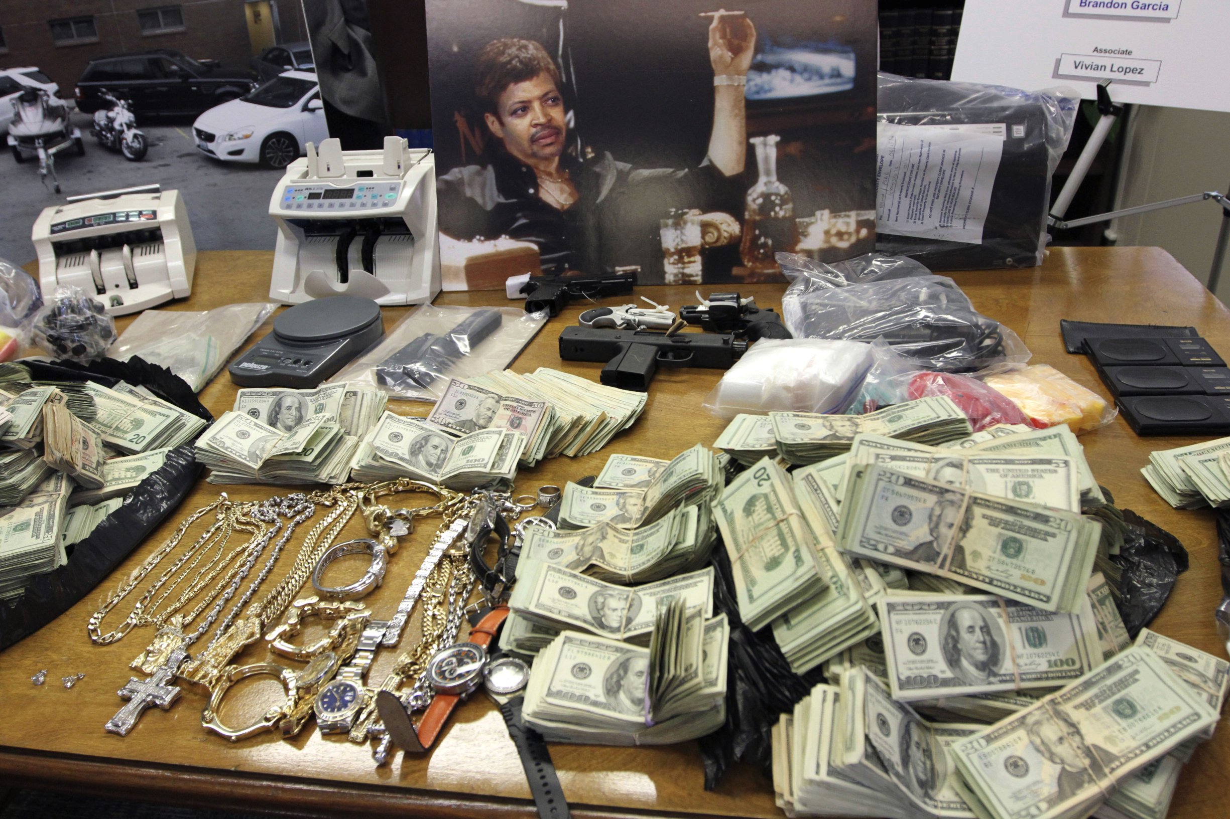 Loot of a captured Manhattan drug lord including a painting of himself as Scarface