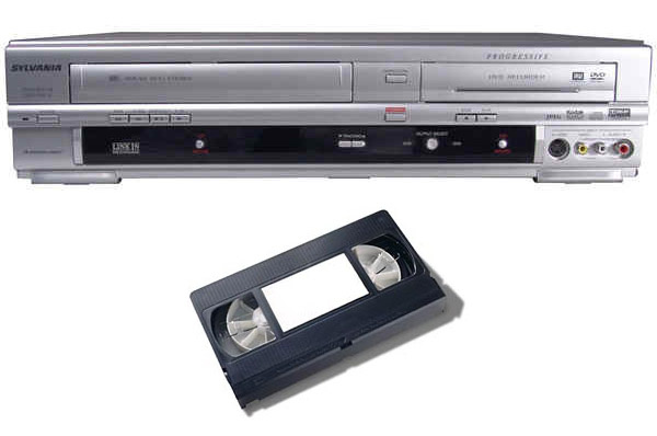 Pushing a tape into a VCR.