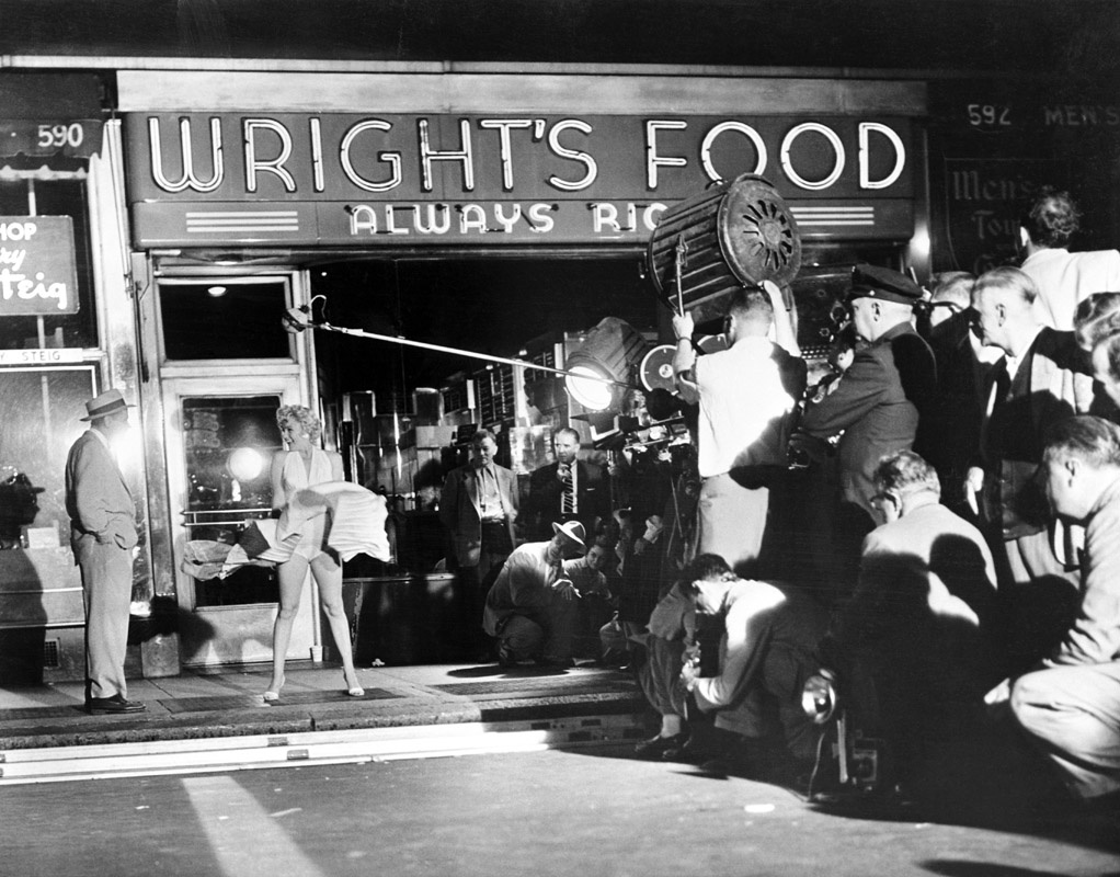 Behind the scenes of the iconic image of Marilyn Monroe standing on the subway grate. On location in NYC, filming of Seven Year Itch