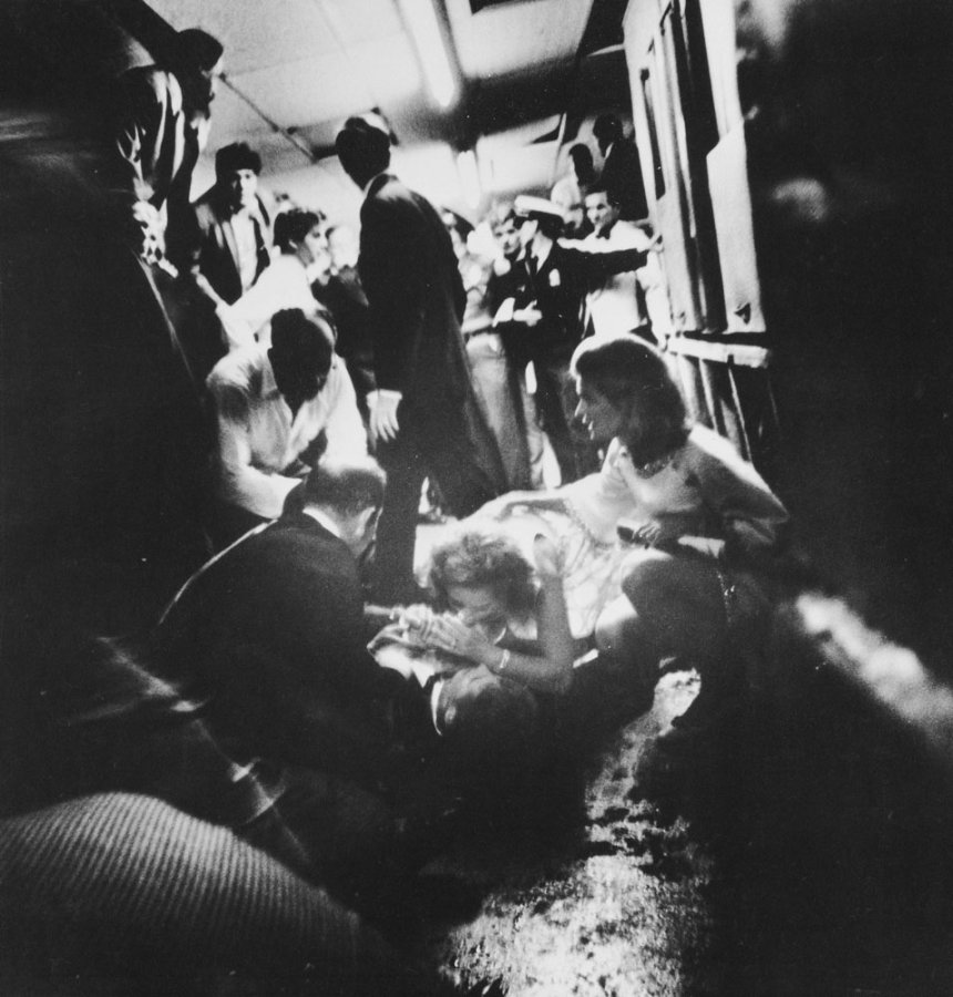 Mrs. Robert Kennedy tries to comfort her husband as he lays mortally wounded on the floor in the kitchen at the Ambassador Hotel. June 6, 1968