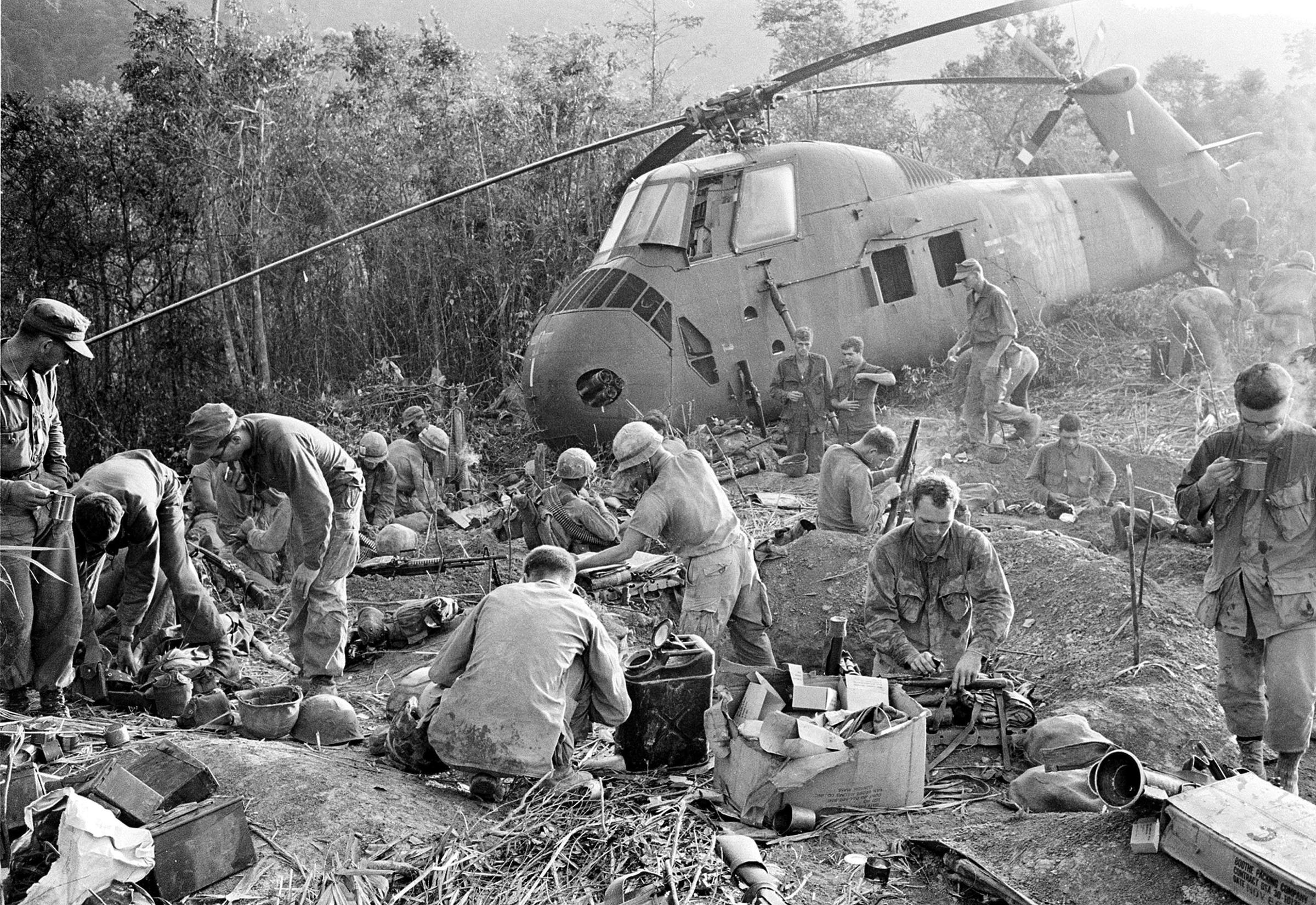U.S. Marines emerge from muddy foxholes after a third night of fighting against of NVA 324 B division troops during the Vietnam War on Sept. 21, 1966