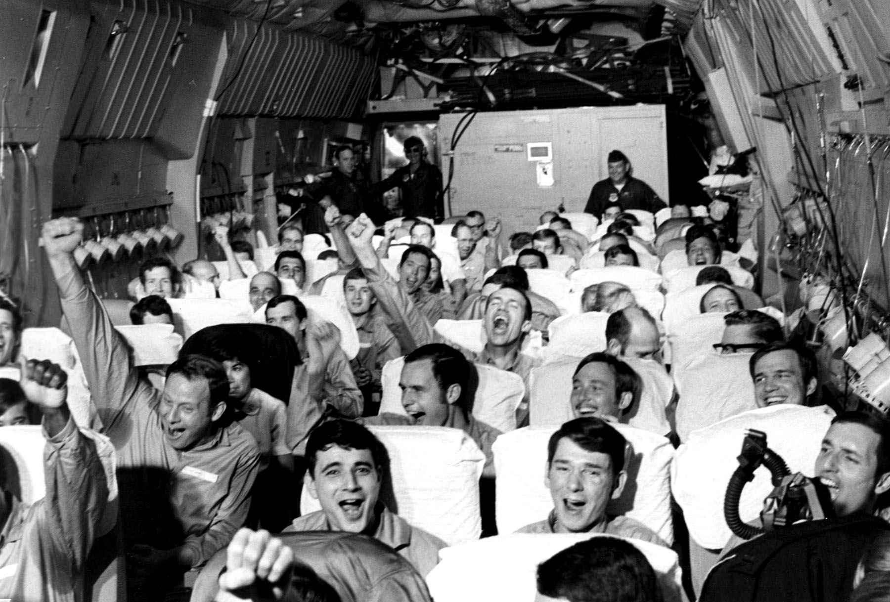 Newly freed POWs in Vietnam celebrate during Operation Homecoming. As their plane lifts off from Hanoi, they know they are finally free