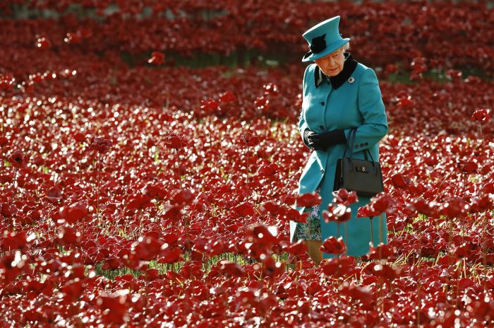 Britains Queen Elizabeth walks through a field of ceramic poppies that form part of the art installation Blood Swept Lands and Seas of Red in London on Oct. 16.