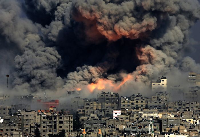 Smoke rises from Tuffah neighborhood after Israeli air strikes in Gaza City on July 29.