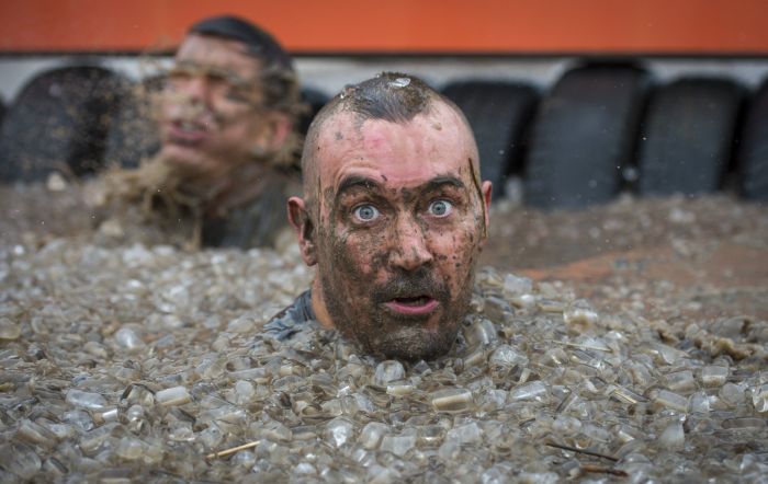 Competitors take part in the Tough Mudder London South on Oct. 25, in Winchester, England.