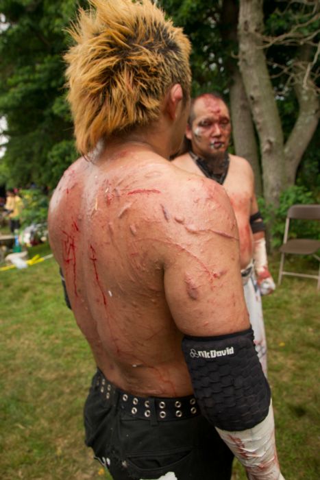 The scarred up back of a Japanese Death Match wrestler