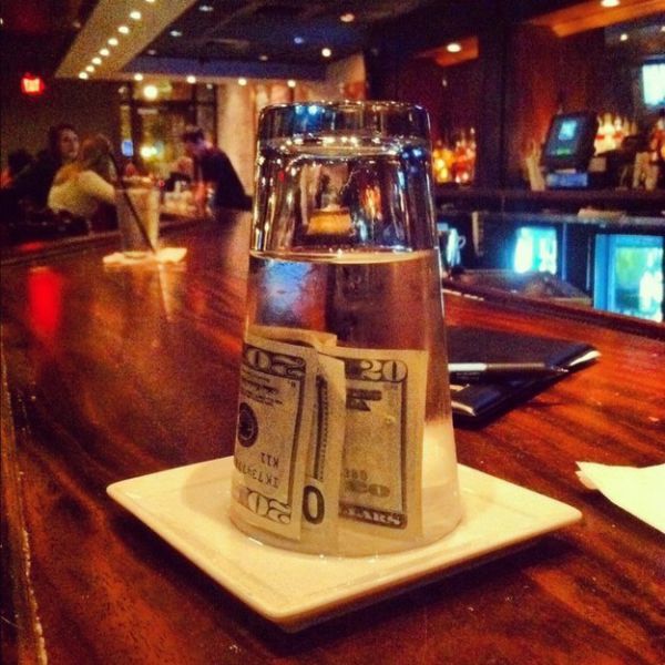 money under glass of water