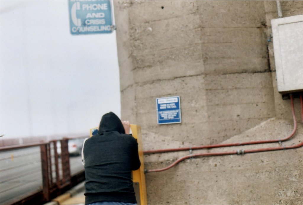 Man using the suicide hotline at the Golden Gate bridge.