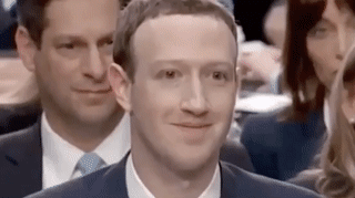 Combined gif of female robot and Mark Zuckerberg smiling at each other in their weird robotic ways