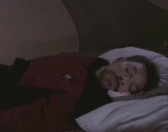 Combined GIF of Star Trek of Data smiling weirdly and Number 1 getting dragged in bed