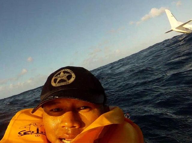 Man survives plane crash, takes this selfie.