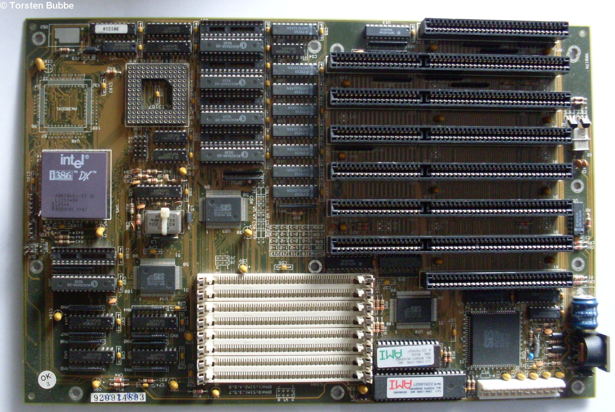 386 Processor and motherboard.  Notice it says DX.  SX meant the lack of a math co processor on the processor.  The open slot above the processor to the right was to add an aftermarket math co processor if you needed one.