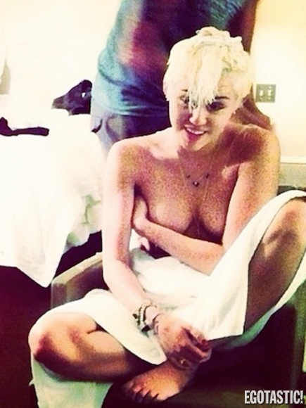 Another Miley Cyrus Covered Topless Pic finds its way to the Internet.