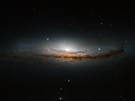 This Hubble image is centered on NGC 5793, a spiral galaxy over 150 million light-years away in the constellation of Libra.
