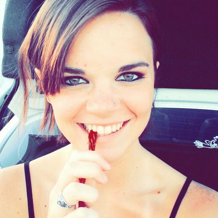 Something sexy about this girl.  Is it the eyes or the way shes likes that twizzler?