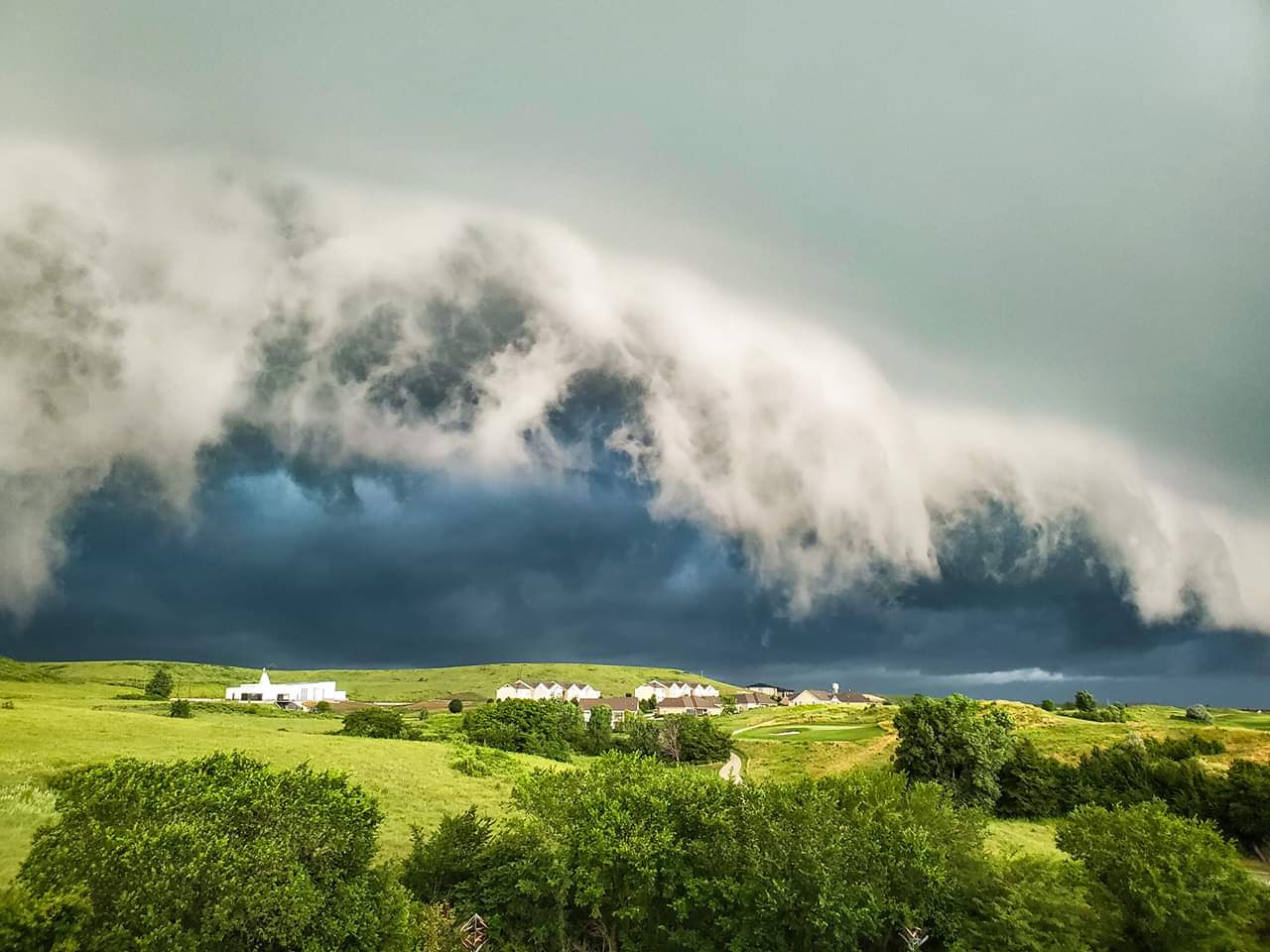 A photo taken this morning by Roger Lanksbury.  Not a Tsunami about to swamp a town, just a storm rolling in outside of Manhattan, KS.