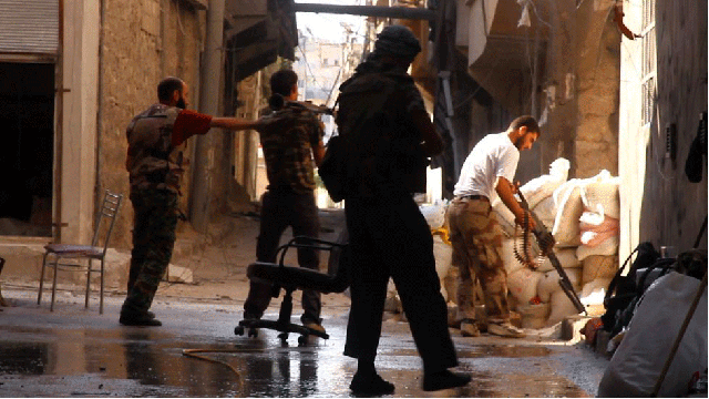 This image sequence of a Syrian army tank firing against a group of rebels in a street of Aleppo is pure and horrible insanity. Taken by Tracey Shelton, it captures the exact moment of a tank shell hitting the rebel position. Miraculously, she survived. Sadly, some of the men weren't so lucky.