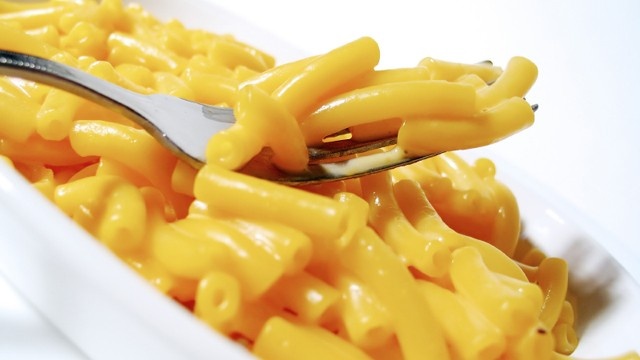 Yellow Dye 5 Coloring Agent -- Found in most boxed macaroni and cheese, Yellow 5 has been banned in Austria and Norway and is being phased out of similar foods in the United Kingdom, according to a petition to remove the dye from Kraft Macaroni  Cheese. Yellow Dye 6 Coloring Agent -- Used in most boxed macaroni and cheese, Yellow Dye 6 and other coloring agents are also found in soda, sports drinks and certain cakes. The use of artificial dyes in food has increased five-fold since 1955, according to the Caltons.