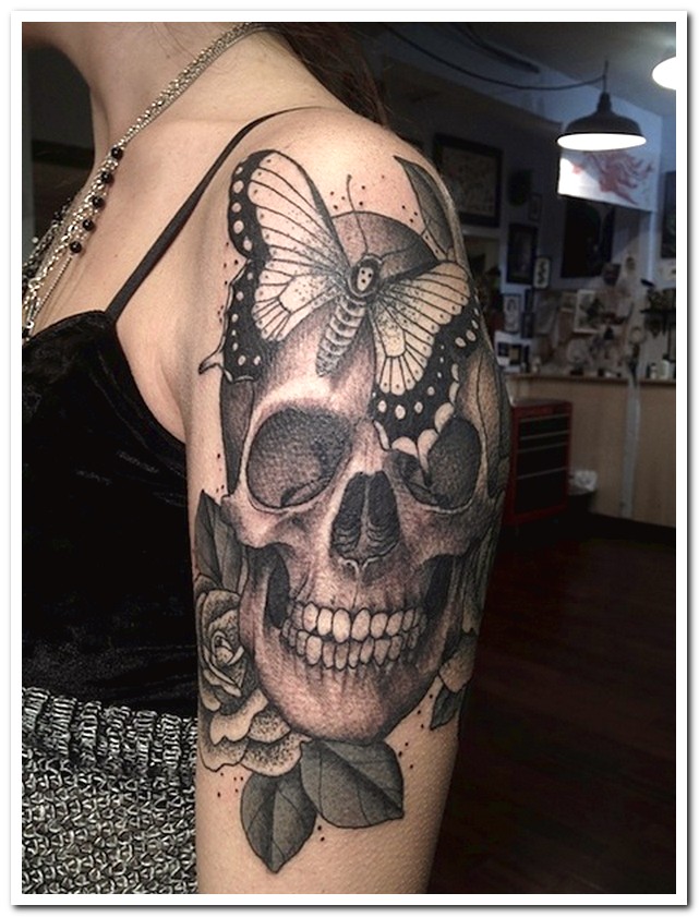 skull tattoo with rose and butterfly