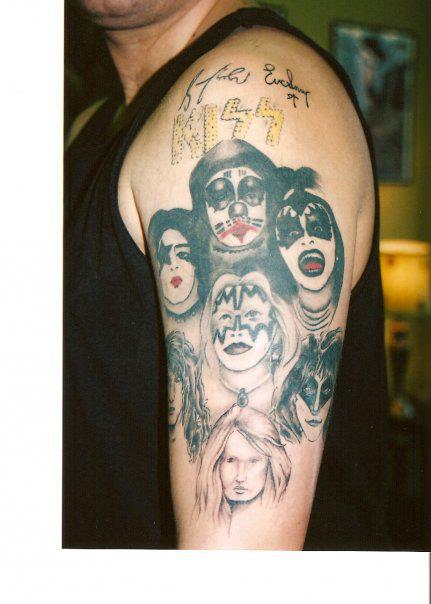 I have my KISS tattoo on my left arm.  With the original KISS Alive logo.  with all four original members.  I also have Bruce Kulick, Eric Carr, and Eric Singer tattooed.  The Bruce Kulick and Eric Singer tattoo tattoo was taken from the Revenge Era and the signates on my tattoo was signes by Bruce Kulick and Eric Singer.