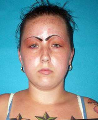 Mugshot FAIL. Her face/eyebrows are like a train wreck, you just cant look away!!!