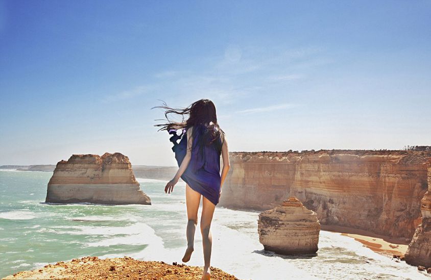 Ahn stands at a cliff overlooking the 12 Apostles on the Great Ocean Road in Australia.