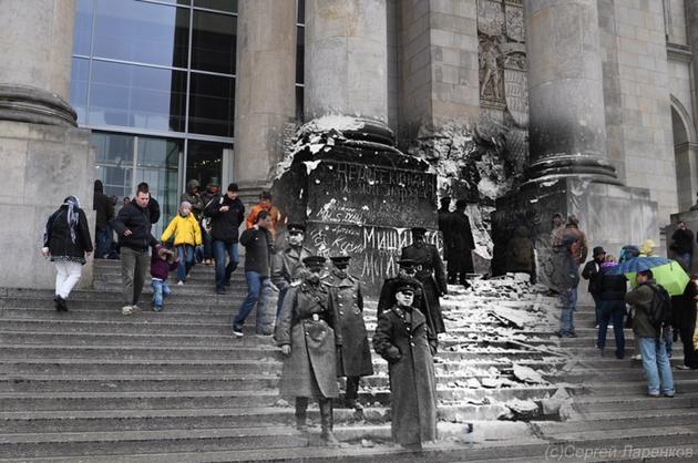 Berlin 1945. Soviet Commanders standing on the steps of the defeated headquarters of German High Command, the Reichstag.