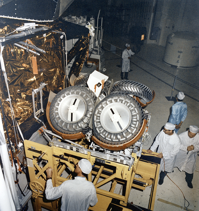 The folded Lunar Roving Vehicle being installed into the Lunar Module