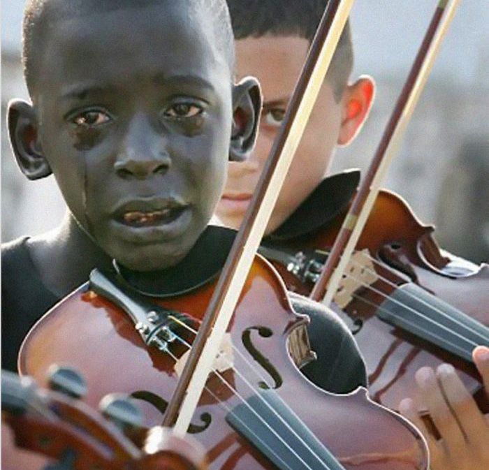 Diego Frazao Torquato, 12 year old Brazilian playing the violin at his teachers funeral. The teacher had helped him escape poverty and violence through music