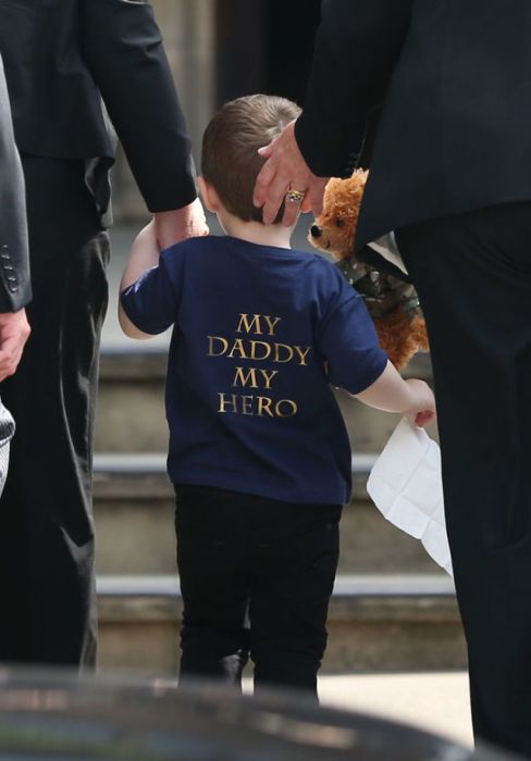 Two-year-old Jack Rigby arrives for the funeral service of his father Fusilier Lee Rigby at Bury Parish Church in Bury, Greater Manchester, England. The Royal Regiment of Fusiliers soldier was killed whilst off duty near Woolwich Barracks in South-East London in May. Michael Adebowale and Michael Adebolajo are accused of 25-year-old's murder.