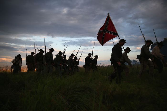 Confederate Civil War re-enactors march for an evening attack during a three-day Battle of Gettysburg re-enactment on June 29, 2013 in Gettysburg, Pennsylvania.