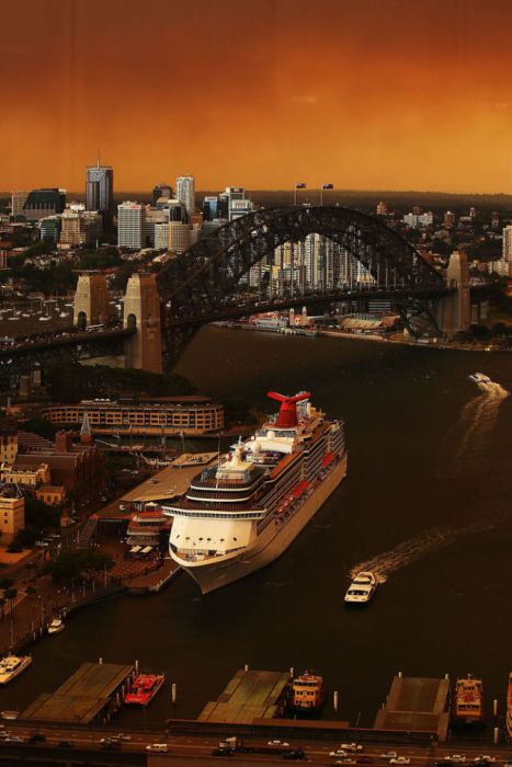 A general view of Sydney harbor shrouded in smoke haze in Sydney, Australia. Sydney is shrouded in a haze of smoke as bushfires rage in the western Sydney suburbs of Springwood, Winmalee and Lithgow.