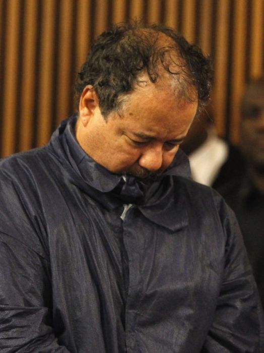 Ariel Castro stands with his head down during his arraignment on kidnapping and rape charges in Cleveland, Ohio. Castro is accused of abducting three girls, Michelle Knight, 32, Amanda Berry, 27 and Gina DeJesus, believed to be about 23 and holding them for about 10-years.