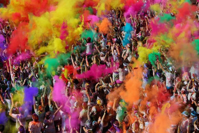 Competitors celebrate completing the Colour Run in Gold Coast, Australia.