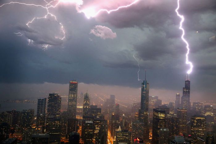 Lightning strikes the Willis Tower formerly Sears Tower in downtown in Chicago, Illinois. A massive storm system with heavy rain, high winds, hail and possible tornadoes is expected to move into Illinois and much of the central part of the Midwest today.