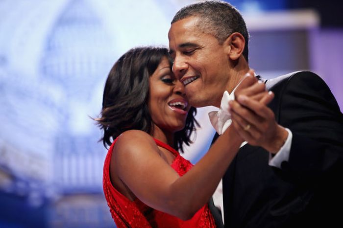 U.S. President Barack Obama and first lady Michelle Obama sing together as they dance during the Inaugural Ball at the Walter Washington Convention Center in Washington, DC. Obama was sworn-in for his second term of office earlier in the day.