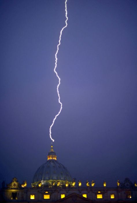 Lightning strikes St Peter's dome at the Vatican. Pope Benedict XVI announced today he will resign as leader of the world's 1.1 billion Catholics because his age prevented him from carrying out his duties -- an unprecedented move in the modern history of the Catholic Church.