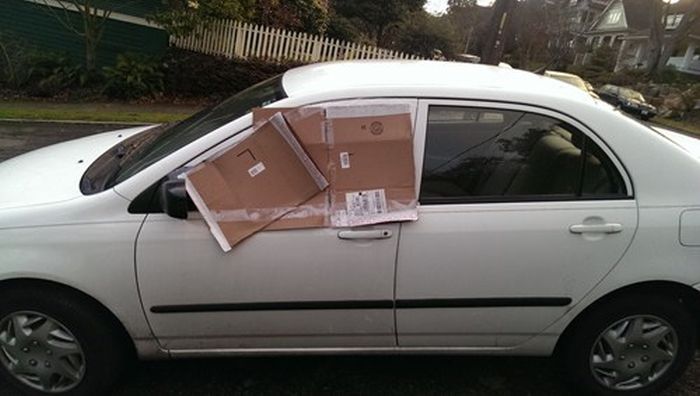 car with cardboard window