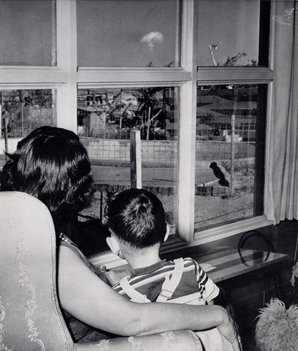 Mom and son watching the mushroom cloud after an atomic test, Las Vegas, 1953