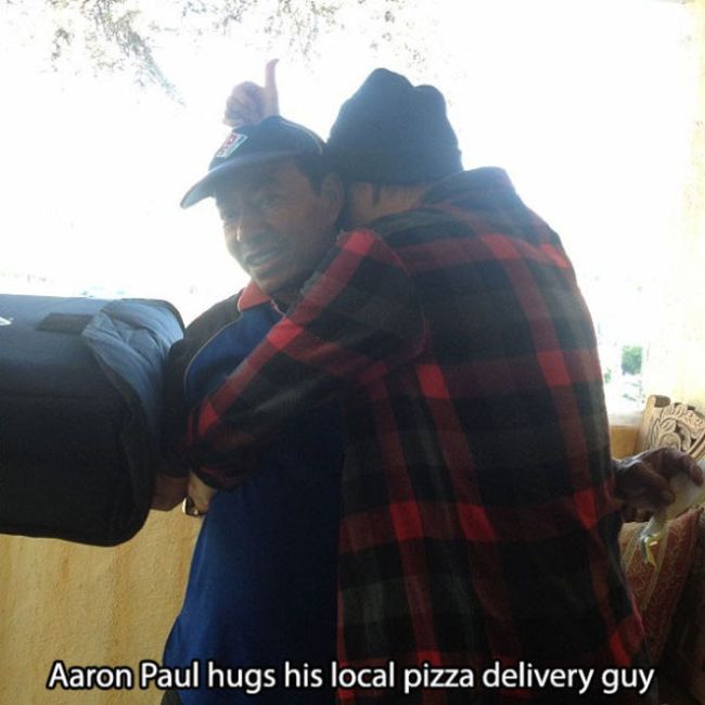 interaction - Aaron Paul hugs his local pizza delivery guy