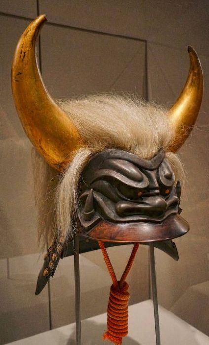 A yak-haired kawari kabuto in the shape of a fierce-looking but protective horned Oni demon head Japan 17th-18th century CE