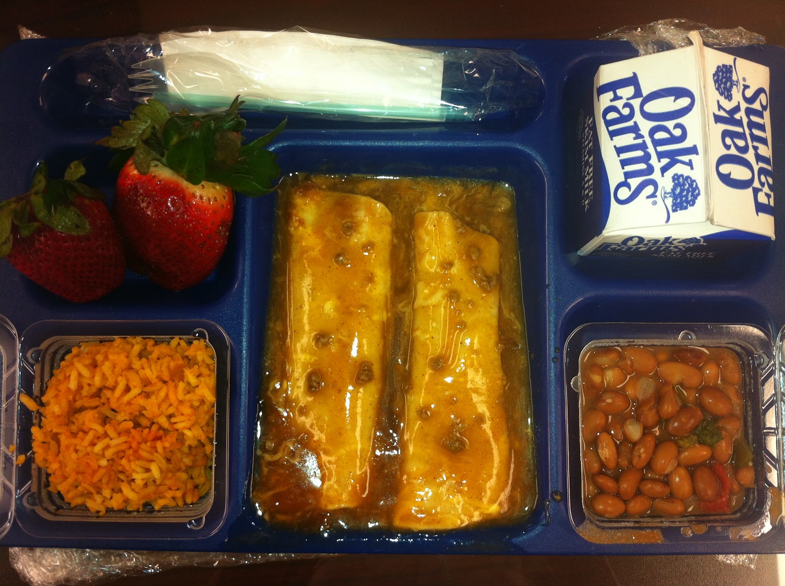 Country: USA. Contents: Beef and Cheese Enchiladas, Spanish Rice, beans a la charra, strawberries, skim milk!