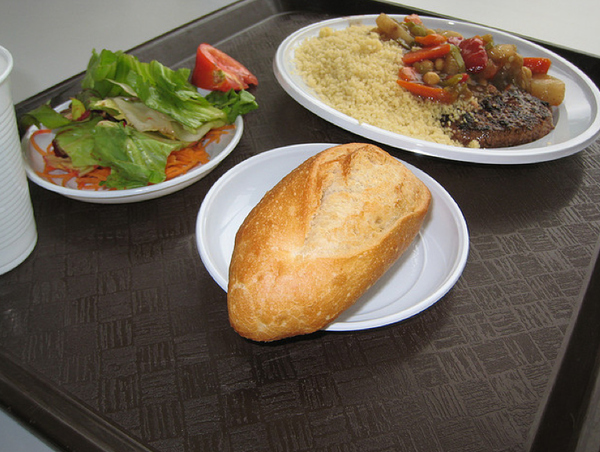 Country: France. Contents: Baguette, salad, couscous, mixed veggies in sauce, meat.