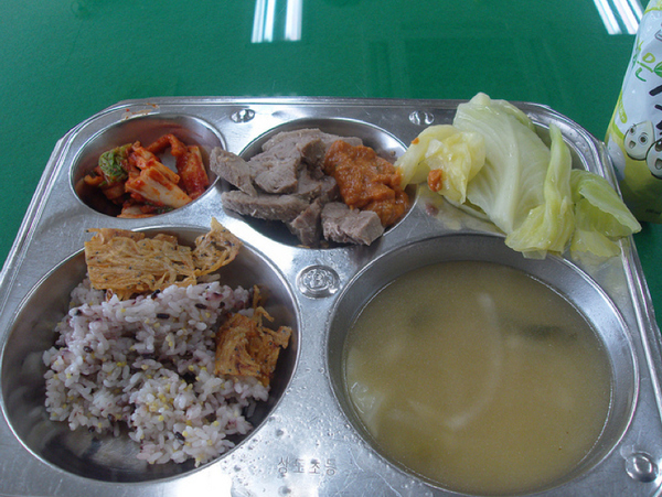 Country: South Korea. Contents: Kimchi, pork, bean paste sauce sammjang, steamed cabbage, soup