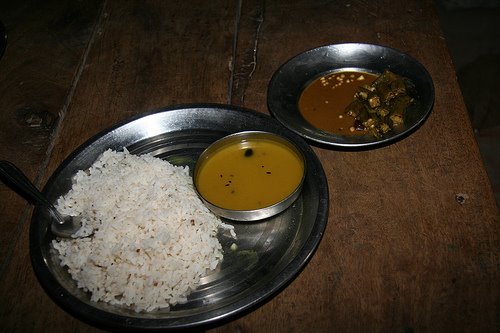 Country: India. Contents: Rice, sauce, ladys finger curry with some Masala.