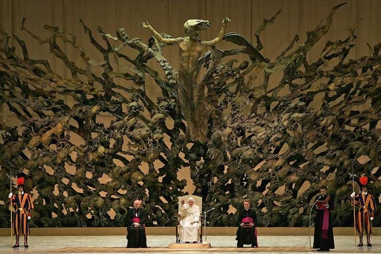 This sculpture is called La Resurrezione. It was created for the Paul VI Audience Hall by Pericle Fazzini in 1971. As you can see, the sculpture depicts Jesus rising from the dead and transforming into a Nazgl.